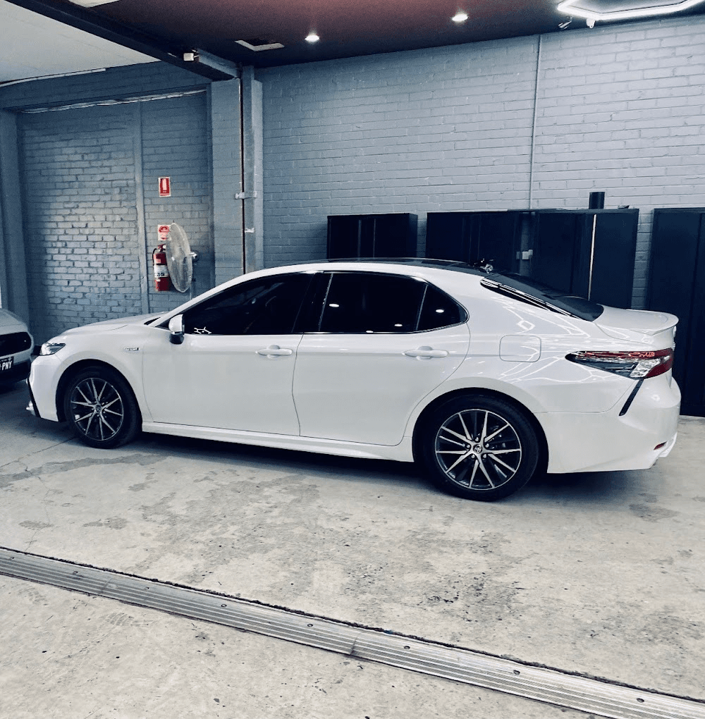 Toyota Camry Hybrid rear view in workshop